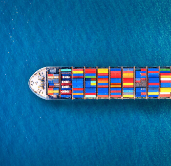 Aerial view of a fully loaded container ship at sea